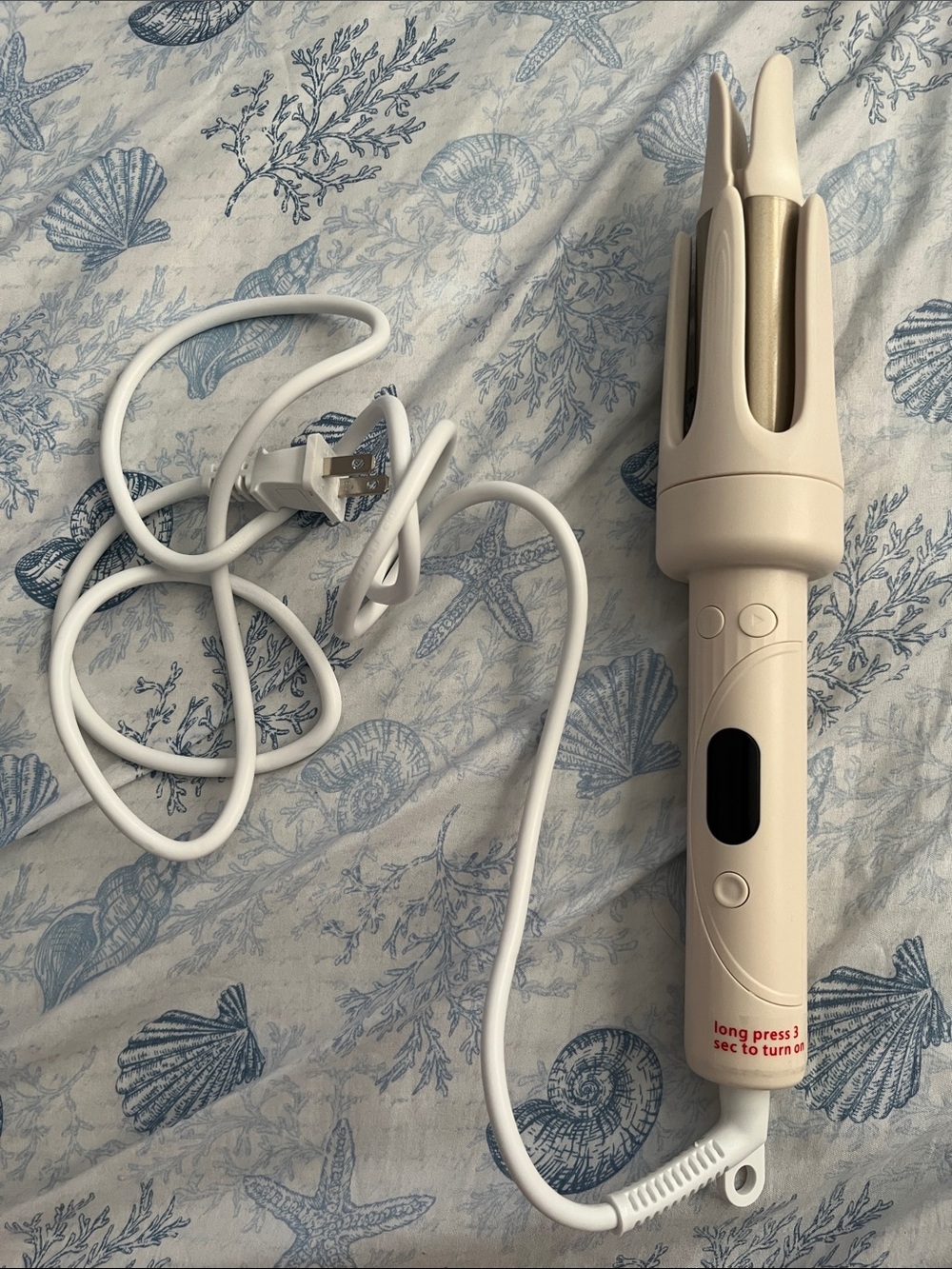 Beige/cream colored Hair Curler